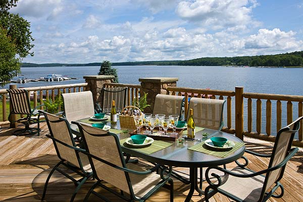 Exterior, horizontal, rear deck with table setting looking out to view of Lake Wallenpaupack, Bat...
