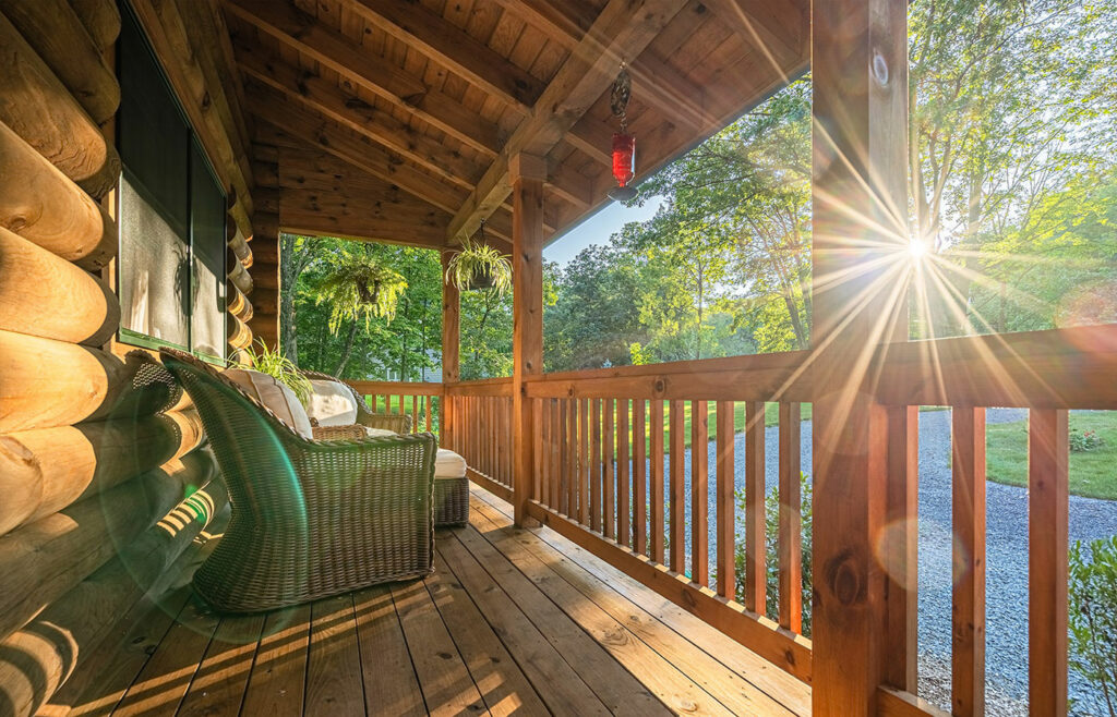 Porch of log home with sun glare