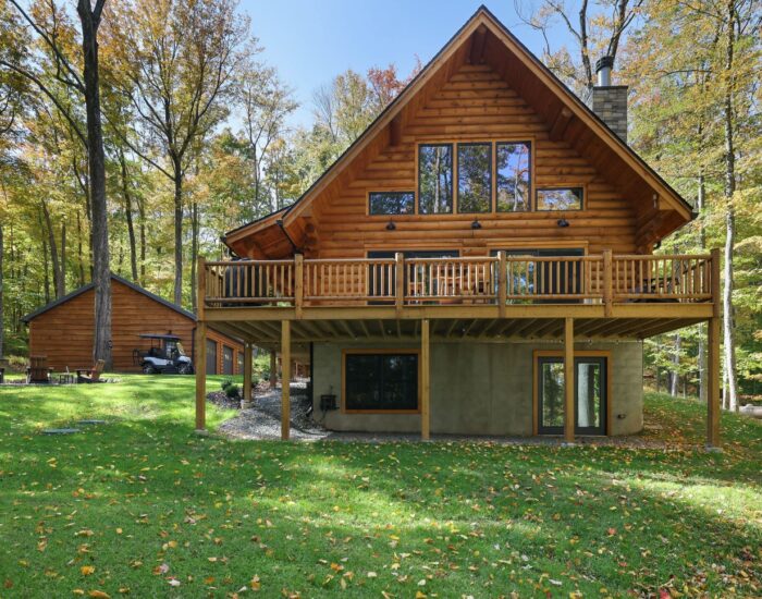 Big log home exterior with deck