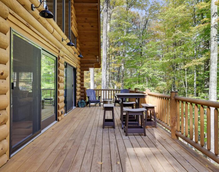 Deck with dining area and trees